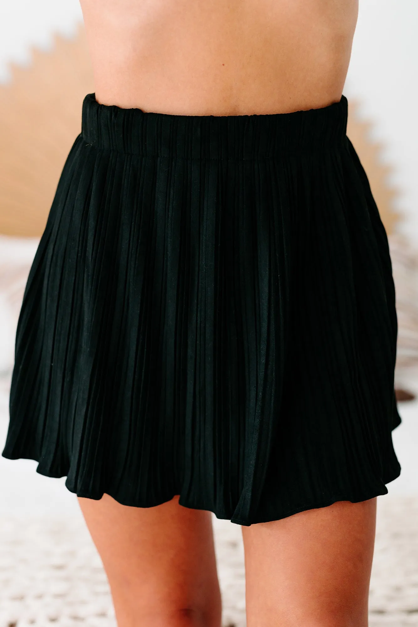 Daringly Devious Pleated Faux Suede Mini Skort (Black)