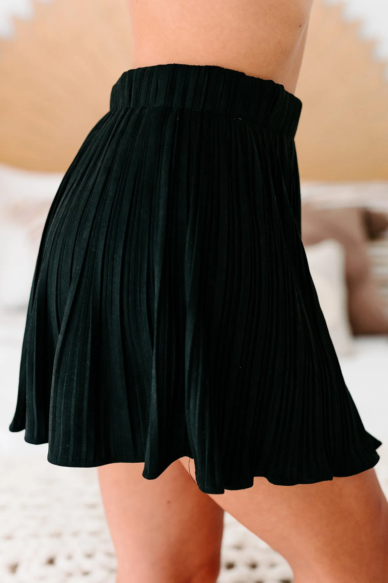 Daringly Devious Pleated Faux Suede Mini Skort (Black)