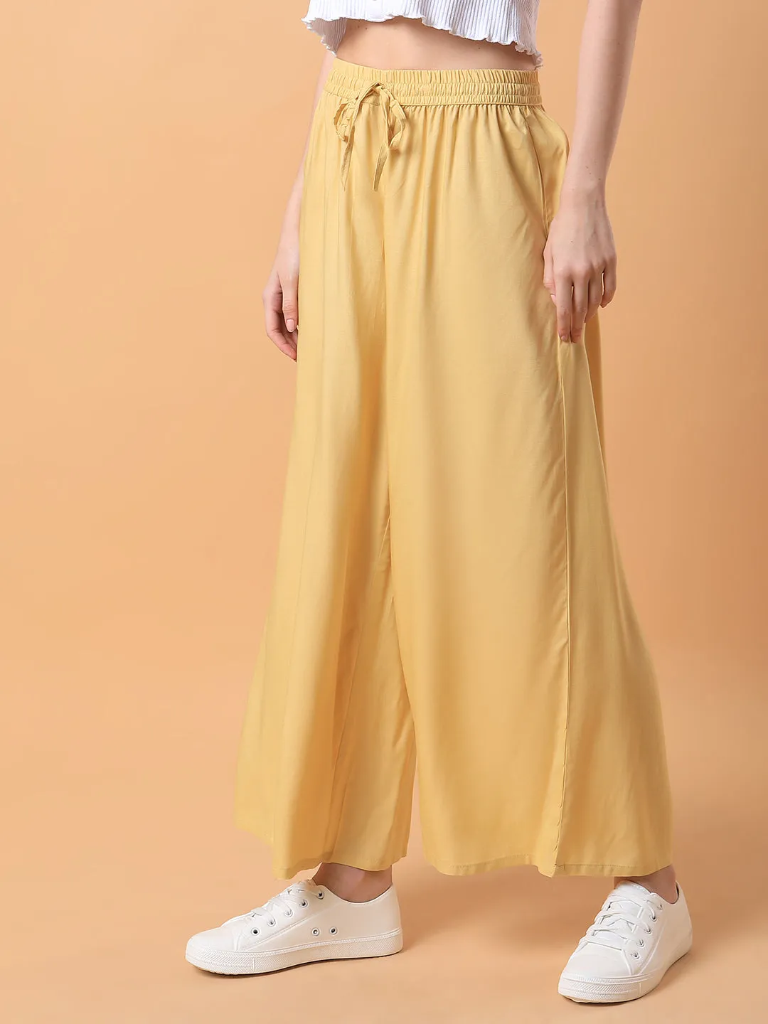 Women Yellow Solid Pleated Loose Fit Trouser